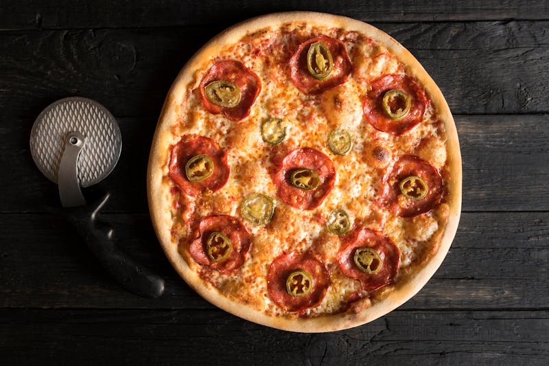 Motor City Meat pizza with sausage, pepperoni and bacon